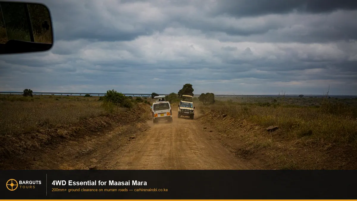 Safari jeep on rough Maasai Mara off road terrain — 4WD required for Kenya safari parks