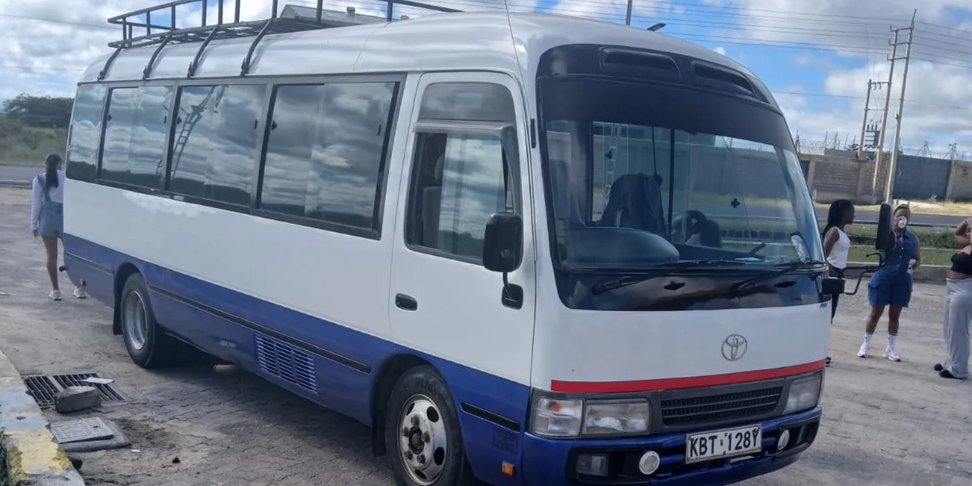 Toyota Coaster bus parked in Nairobi, minivan and bus hire from Barguts Tours.