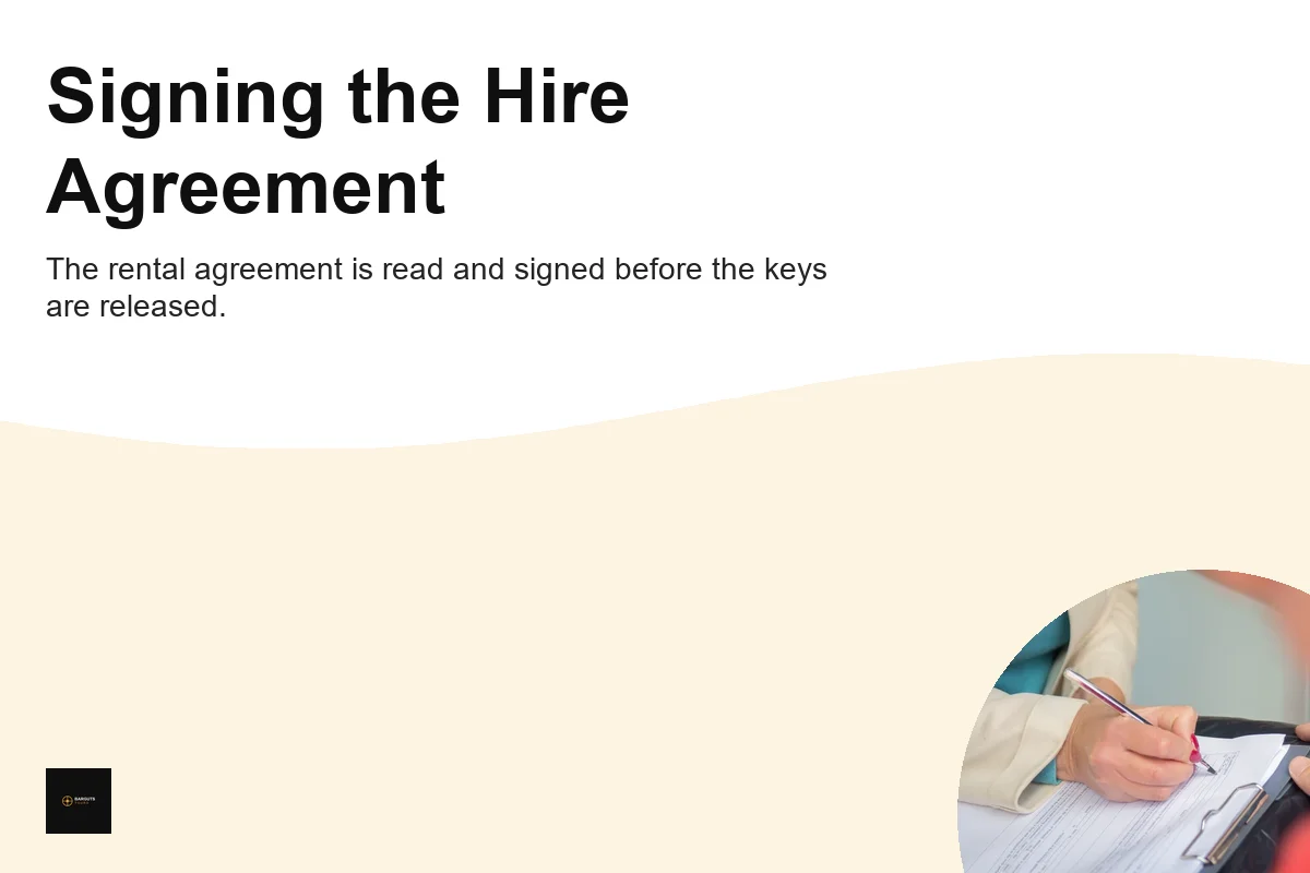 Customer signing a car hire agreement at pickup