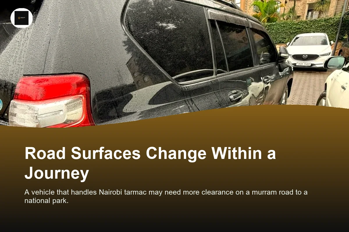 Black Toyota Prado on a wet road, rear view